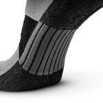 Close-up of black and grey no-show running sock showing arch support and heel construction