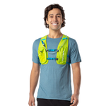 Man wearing Nathan QuickStart 2.0 hydration vest in lime green with blue straps