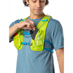 Man wearing Nathan QuickStart 2.0 hydration pack in lime green with white text