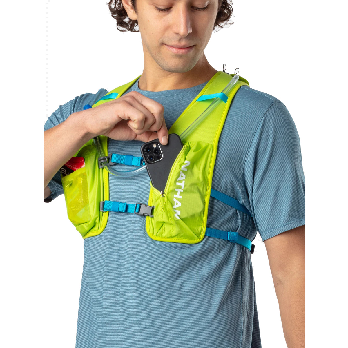 Man wearing Nathan QuickStart 2.0 hydration pack in lime green with white text