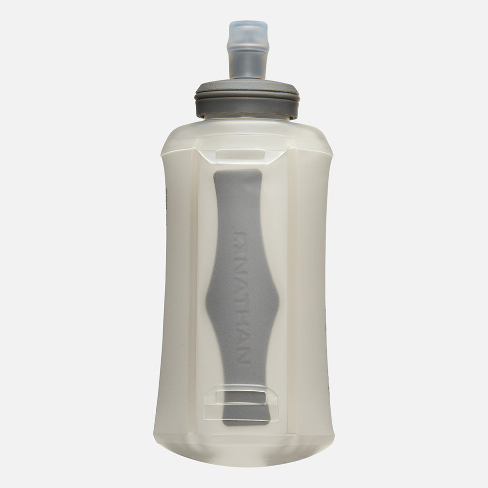 Nathan clear soft flask with gray bite top and internal folding mechanism visible