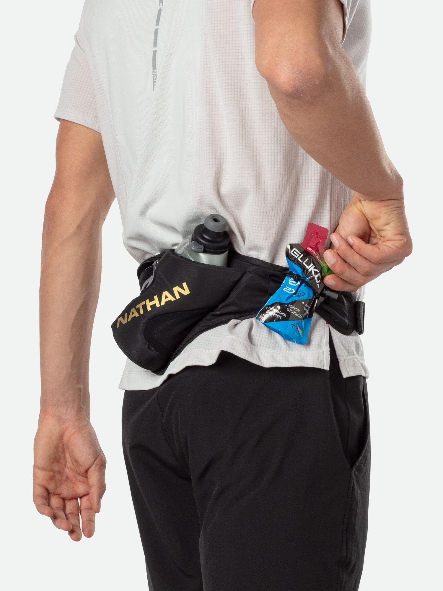 Nathan Peak Hydration Waist Pack in black worn around waist showing storage compartments