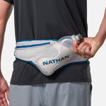 Nathan Peak Hydration Waist Pack in Vapor Grey with Sailor Blue trim worn around waist