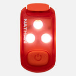 Nathan red strobe safety light with three bright LED lights illuminated and power button