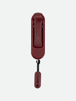 Nathan SaferRun Ripcord personal safety alarm in burgundy red with attached lanyard