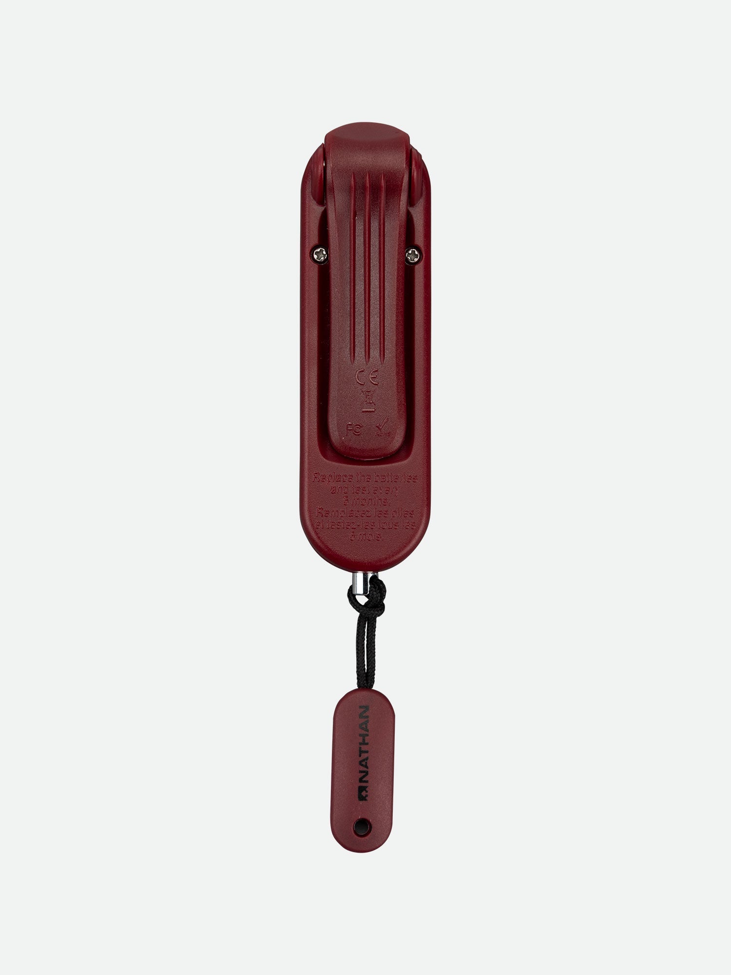 Nathan SaferRun Ripcord personal safety alarm in burgundy red with attached lanyard
