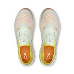 On CloudCoast women's running shoes in cream and pale green colorway