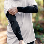 Person wearing black OS1st performance compression arm sleeves with textured pattern
