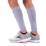OS1st CS6 Performance Calf Sleeves in grey worn on legs with athletic shoes