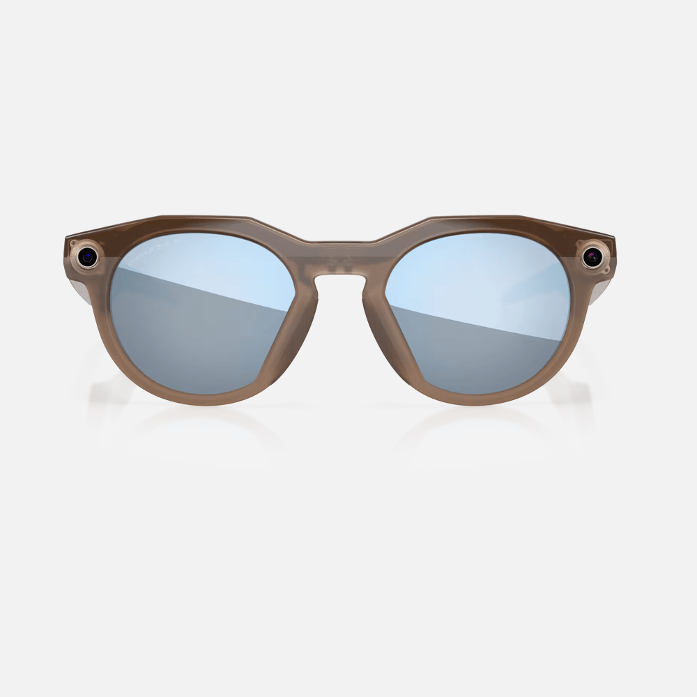Oakley Meta HSTN sunglasses with translucent brown frames and blue polarized lenses