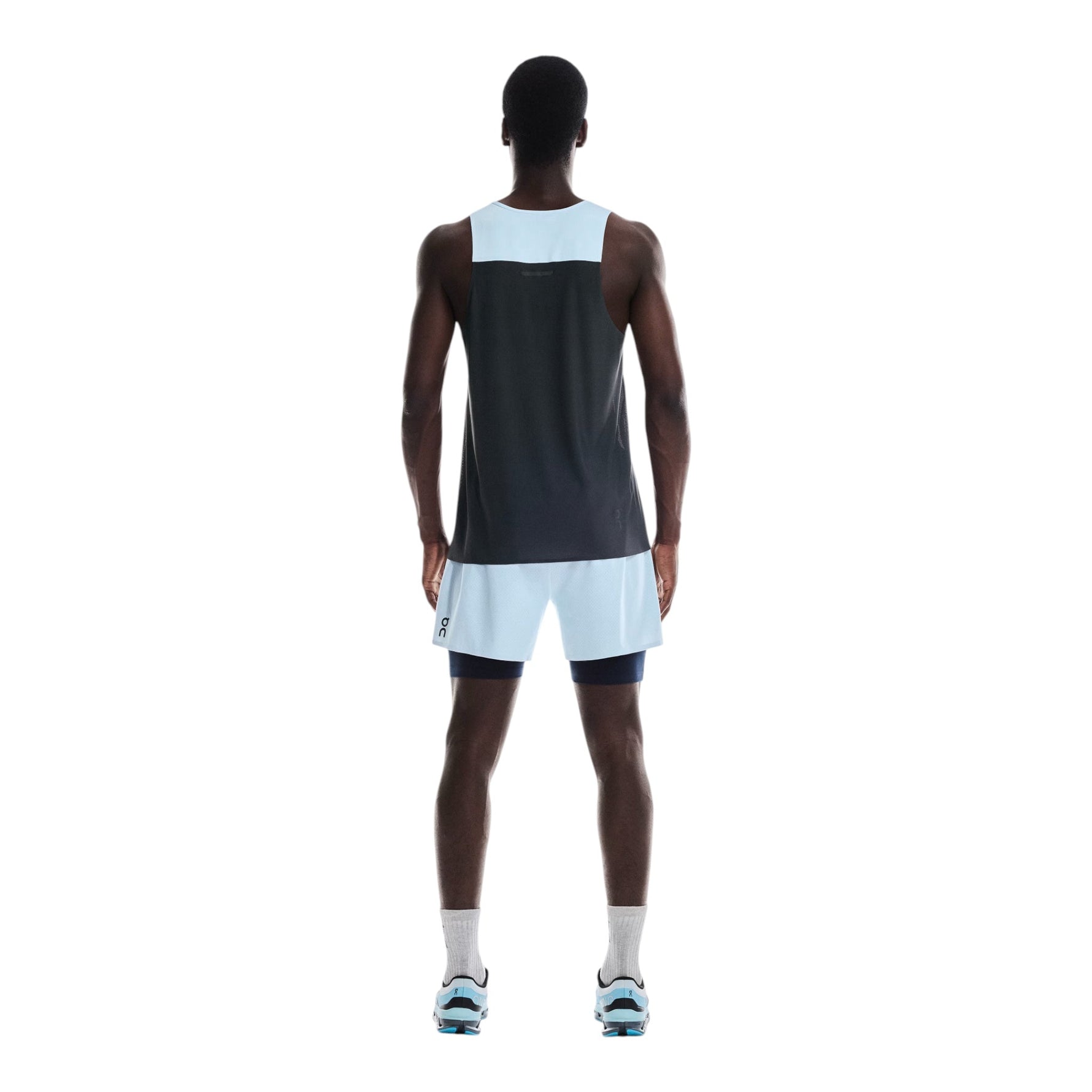 Back view of man wearing On Performance 2/1 Shorts in Malibu blue with midnight accents