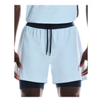 On 5 inch Performance 2-in-1 men's running shorts in light blue with navy liner