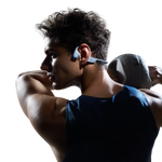 Athlete wearing blue Shokz OpenRun PRO 2 bone conduction headphones during workout