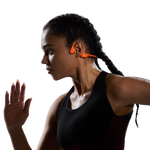 Woman wearing orange Shokz OpenRun Pro 2 bone conduction headphones during workout