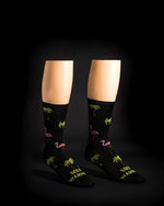 Black Solo Warrior socks with tropical pattern of palm trees and flamingos