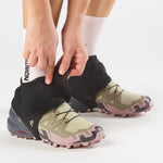 Salomon Trail Gaiters Low in black being worn over trail running shoes