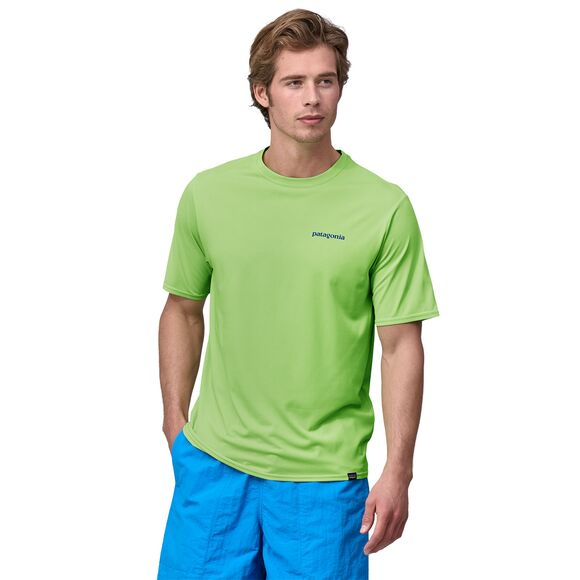 Man wearing bright green Patagonia t-shirt with small logo on chest