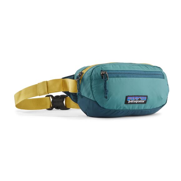 Patagonia Terravia Mini Hip Pack in teal blue with yellow adjustable waist strap