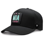 Black Miami trucker hat with MIA airport code patch and perforated sides