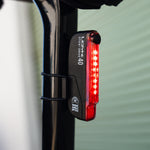 Lezyne Stick Drive 40 rear bike light with red LED illumination mounted on seat post