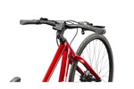 Cannondale Quick 3 bicycle in metallic red showing handlebars and front wheel