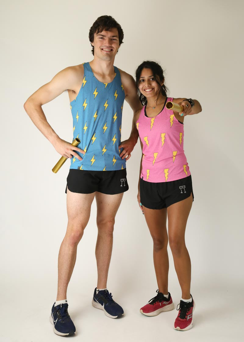 Man wearing blue tank top with yellow lightning bolts standing with woman