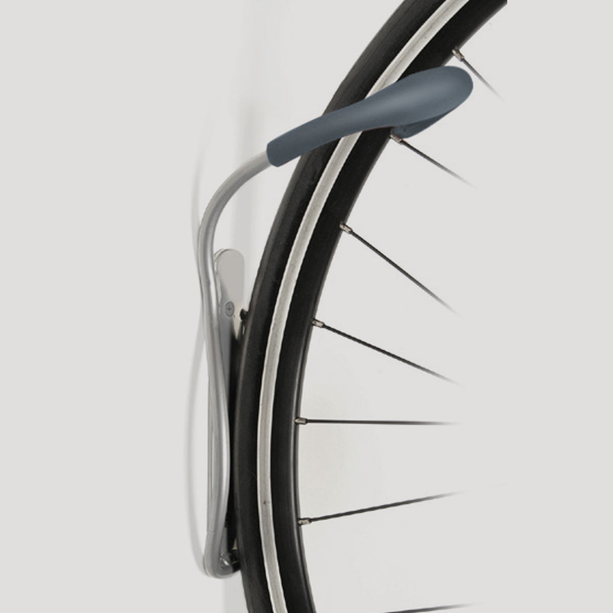 Delta grey wall-mounted bike rack holding bicycle wheel against white background