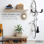 Delta white bike wall mount holding bicycle vertically in modern home setting