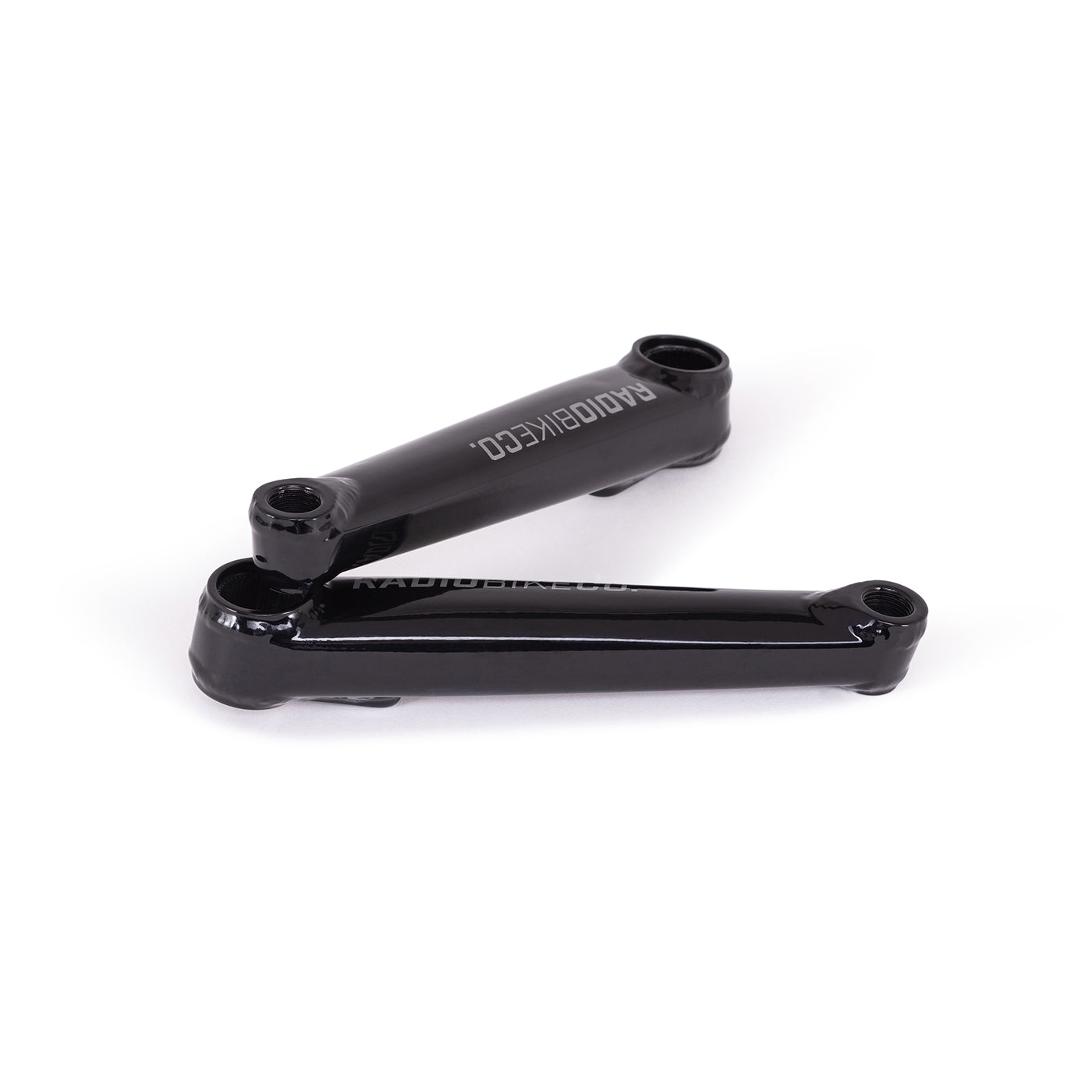 Radio Destro Light bicycle cranks in glossy black finish on white background
