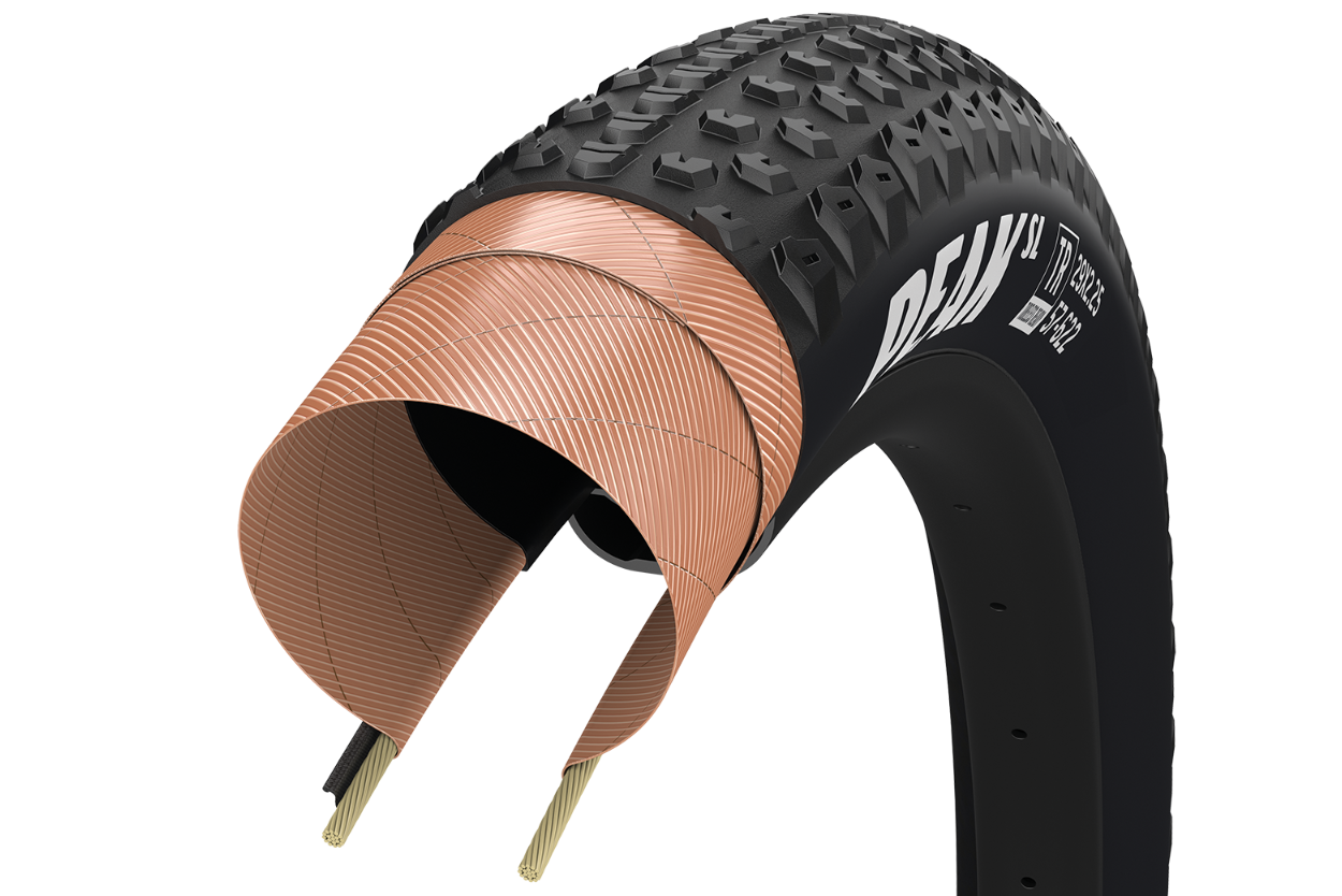 Goodyear Peak SL Race tubeless bicycle tire with cross-section showing internal copper wire construction