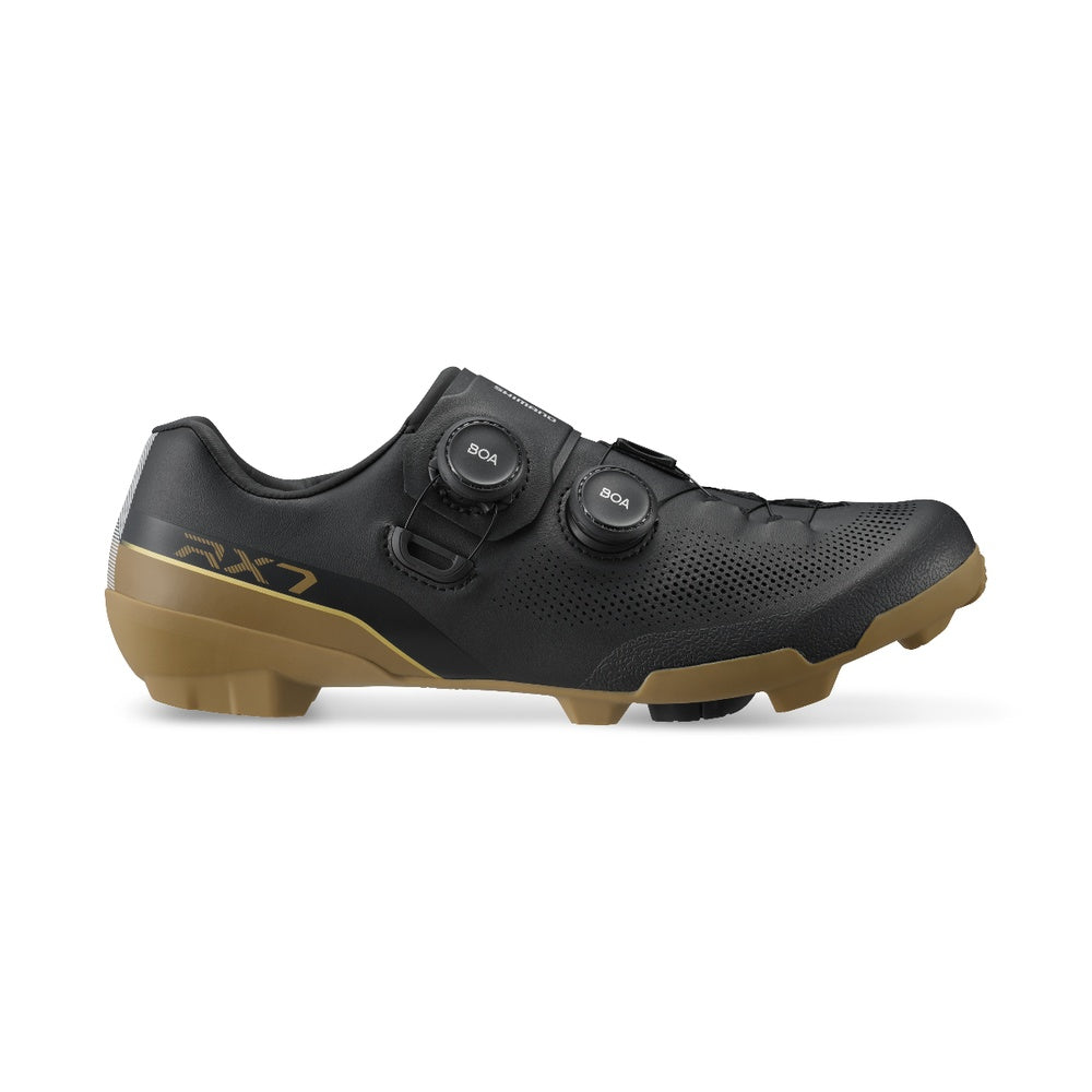 Shimano RX7 gravel cycling shoe in black with gum sole, dual BOA closure, lateral view