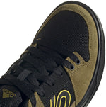 Five Ten Freerider MTB shoe in black with olive green trim and yellow accents