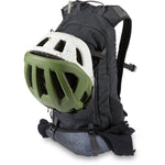 Dakine SYNCLINE 12L black mountain bike backpack with green helmet attached