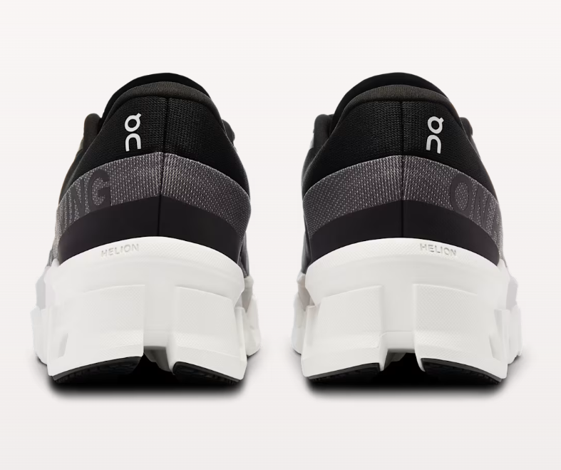 On Cloudmonster 2 running shoes rear view showing black gray colorway with white sole