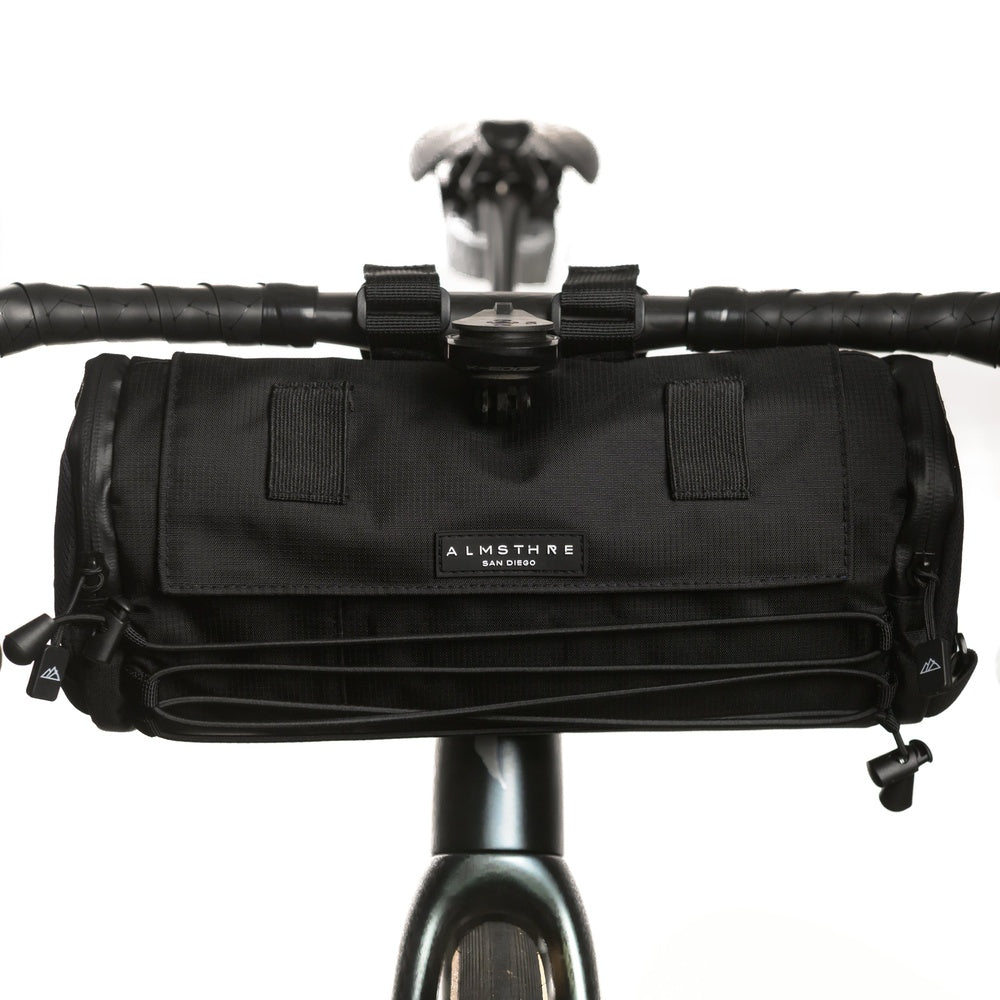 Black Almsthre bicycle handlebar bag mounted on bike with clean white background