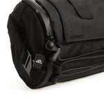 Close-up of black Almsthre bar bag showing zipper pull and mountain logo detail