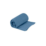 Sea to Summit Drylite Towel in Moonlight Blue, rolled and partially unfolded showing compact design