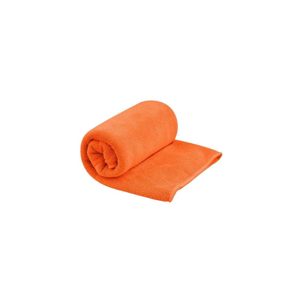 Sea To Summit Tek Towel in bright orange color, partially rolled up