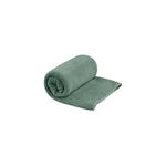 Sea To Summit Tek Towel in sage green color, partially rolled on white background
