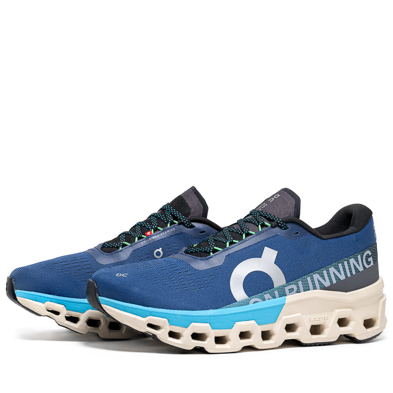 On Cloudmonster 2 running shoes in blue and gray colorway with distinctive cloud sole