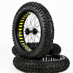 Super73 yellow wheel liner installed on fat bike wheels with knobby tires