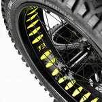 Super73 yellow wheel liner installed on black bicycle wheel with spokes