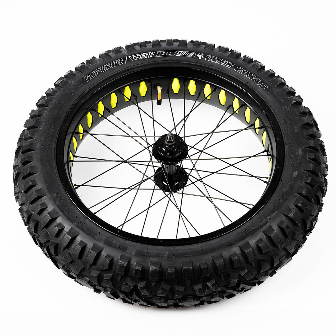 Super73 wheel with yellow spoke liners on black rim with knobby tire