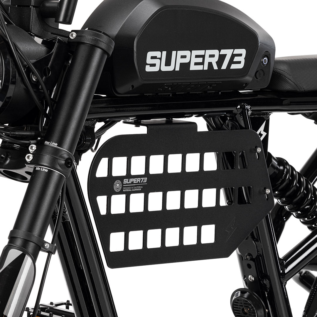 Black Super73 MOLLE panel with rectangular cutouts mounted on electric bike frame