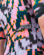 Close-up of TheOneOff back label and rear pocket detail on Krypton jersey in Bromine colorway