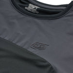 Troy Lee Designs Drift SS Jersey in Dark Charcoal showing embossed logo detail