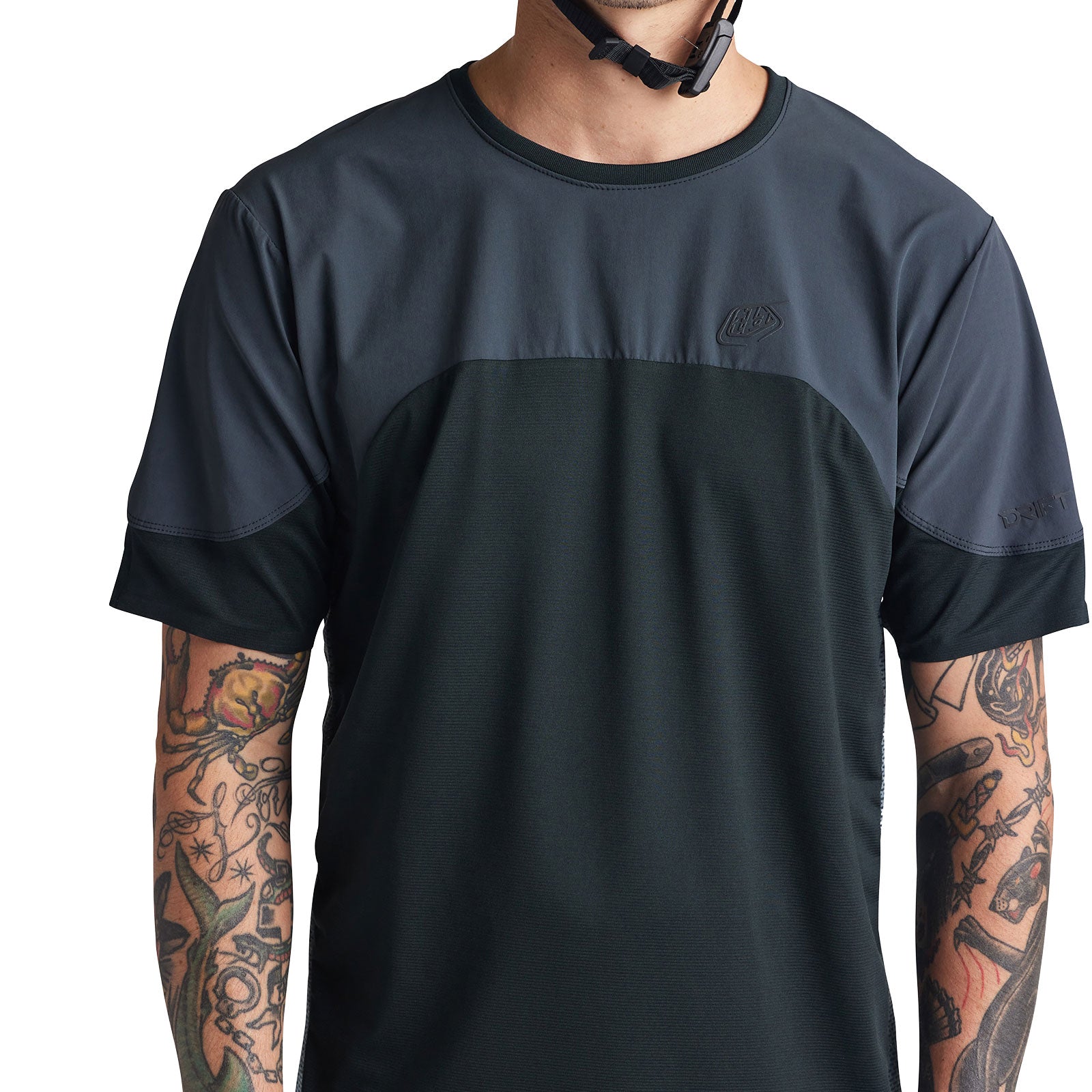 Troy Lee Designs Drift SS Jersey in dark charcoal carbon colorway worn by model