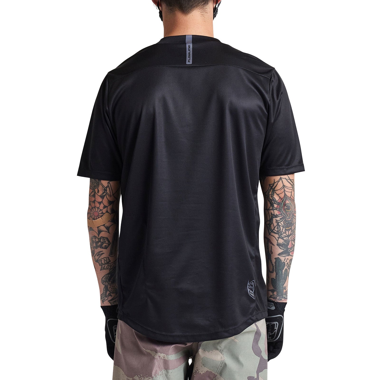 Troy Lee Designs Flowline Short Sleeve Jersey in solid black, back view showing tattooed rider