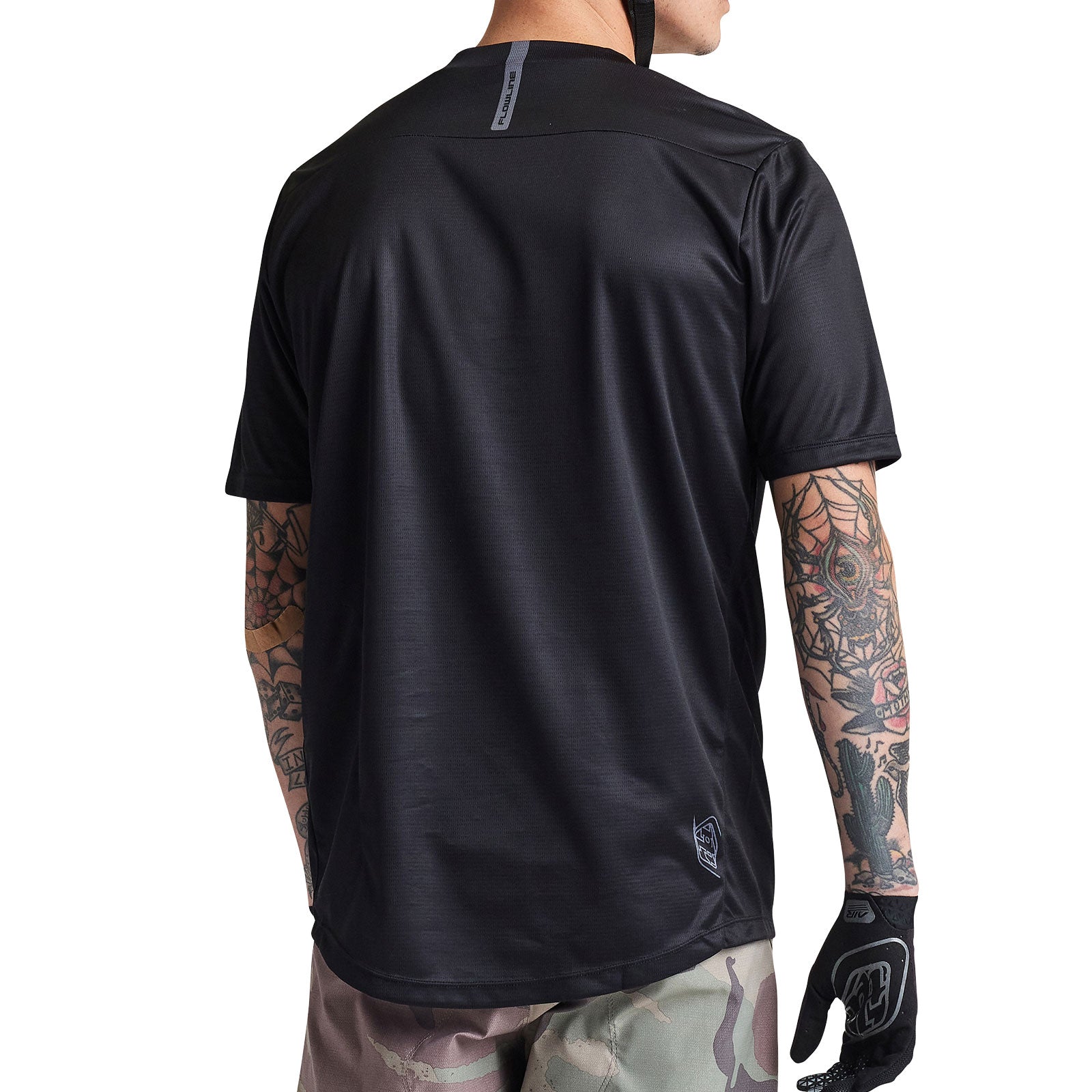 Troy Lee Designs Flowline Short Sleeve Jersey in solid black, back view showing athletic fit