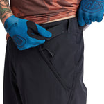 Troy Lee Designs black MTB cycling shorts with zippered pocket detail